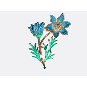 Blue Enamel Flower Brooch With Gold Tone Accents and Green Leaves
